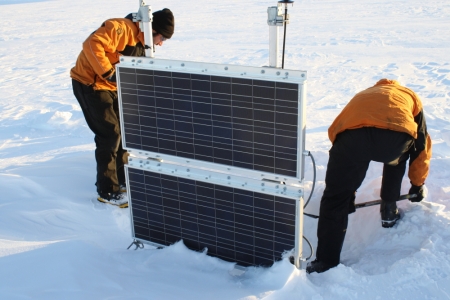 Adam and Roger begin digging in an attempt to uncover the lid of the continuous GPS electronics enclosure. Note that the snow surface is just touching the bottom of the bottom panel indicating an acculation of over 6 feet of snow since its installation in January 2010.