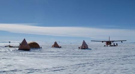 tents and airplanes on the antarctic ice sheet